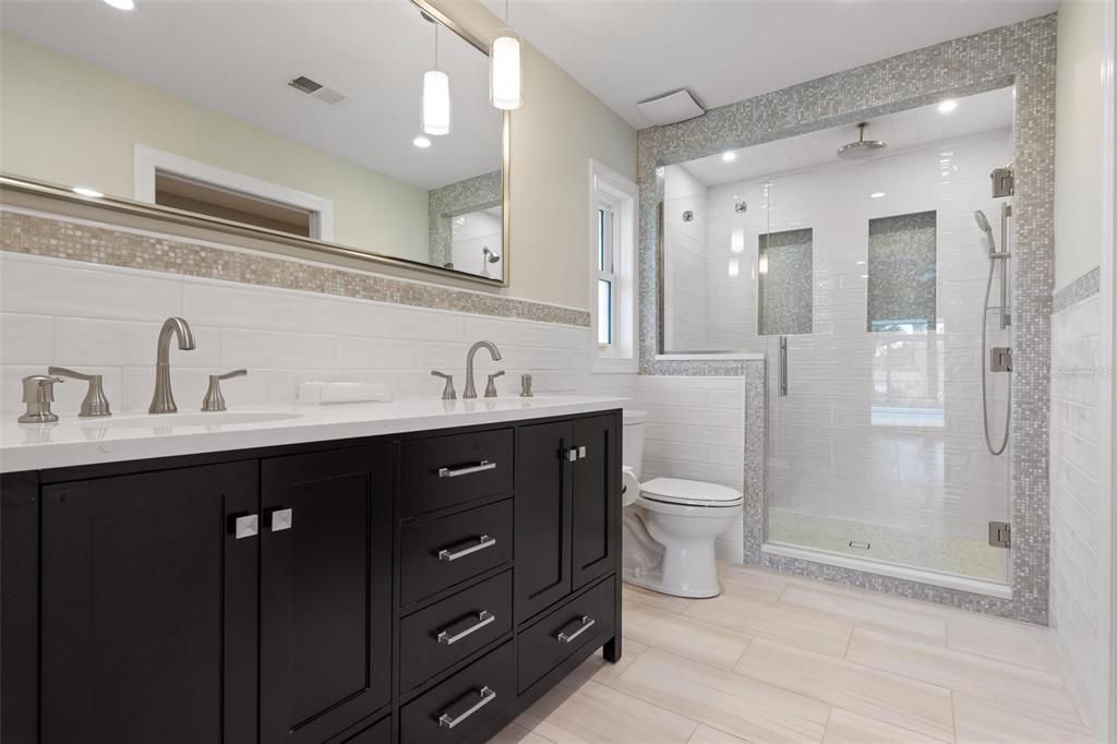 Bathroom, Dual Sink Vanities, Glass Shower, Interior, Pendant Lights, Recessed Lighting, Wood Texture Flooring