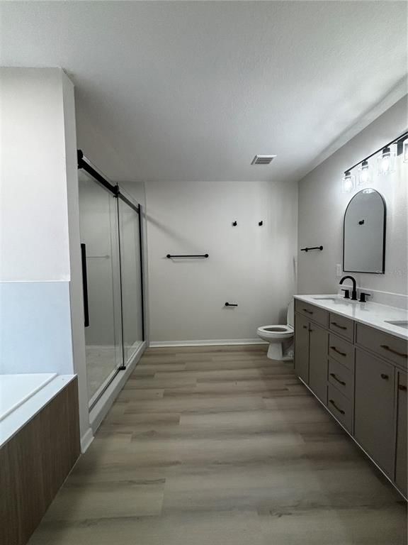 Bathroom, Dual Sink Vanities, Glass Shower, Interior, Wood Texture Flooring