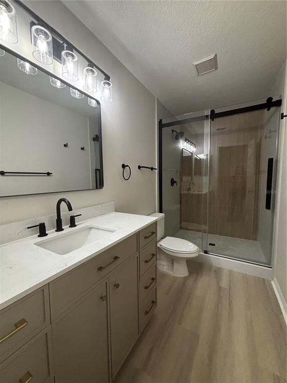 Bathroom, Dual Sink Vanities, Glass Shower, Interior, Wood Texture Flooring