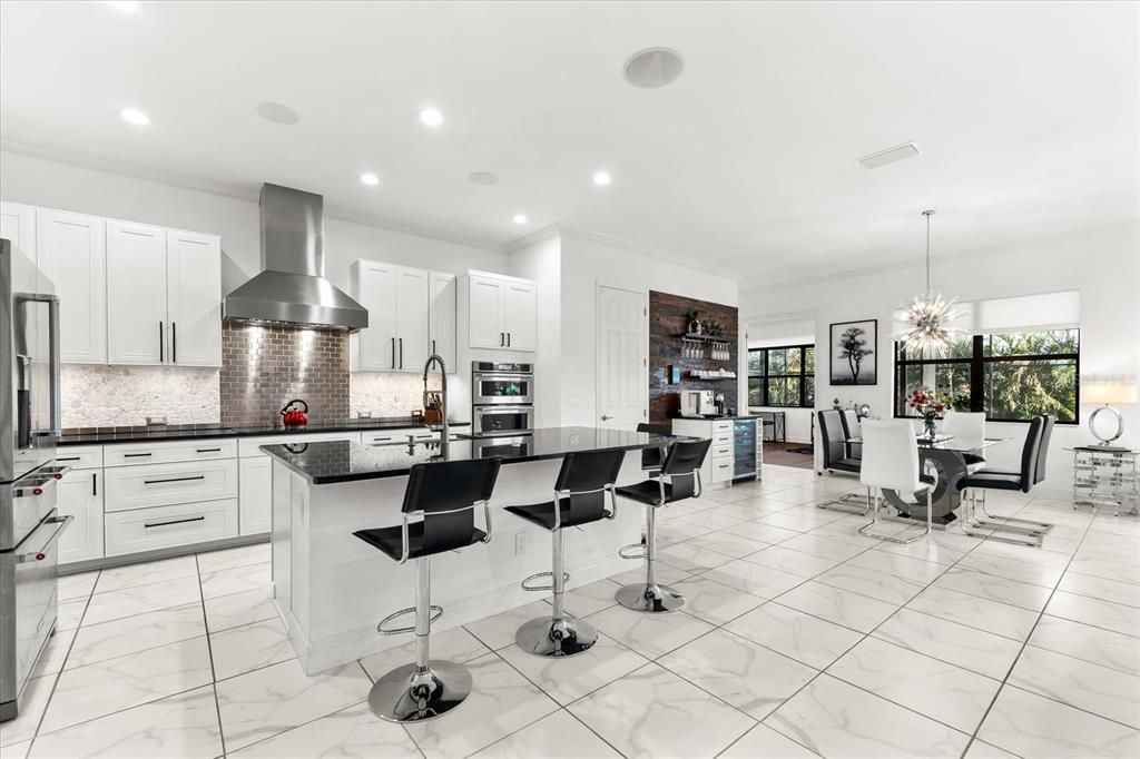 Chandelier, Dining room, Interior, Kitchen, Marble, Pendant Lights, Recessed Lighting, Stainless Steel Appliances