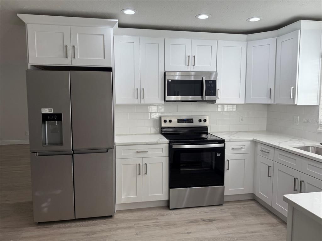 Interior, Kitchen, Recessed Lighting, Stainless Steel Appliances, Wood Texture Flooring