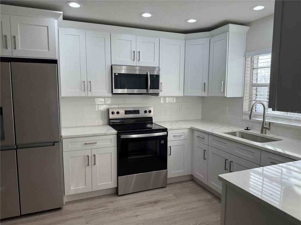 Interior, Kitchen, Recessed Lighting, Stainless Steel Appliances, Wood Texture Flooring