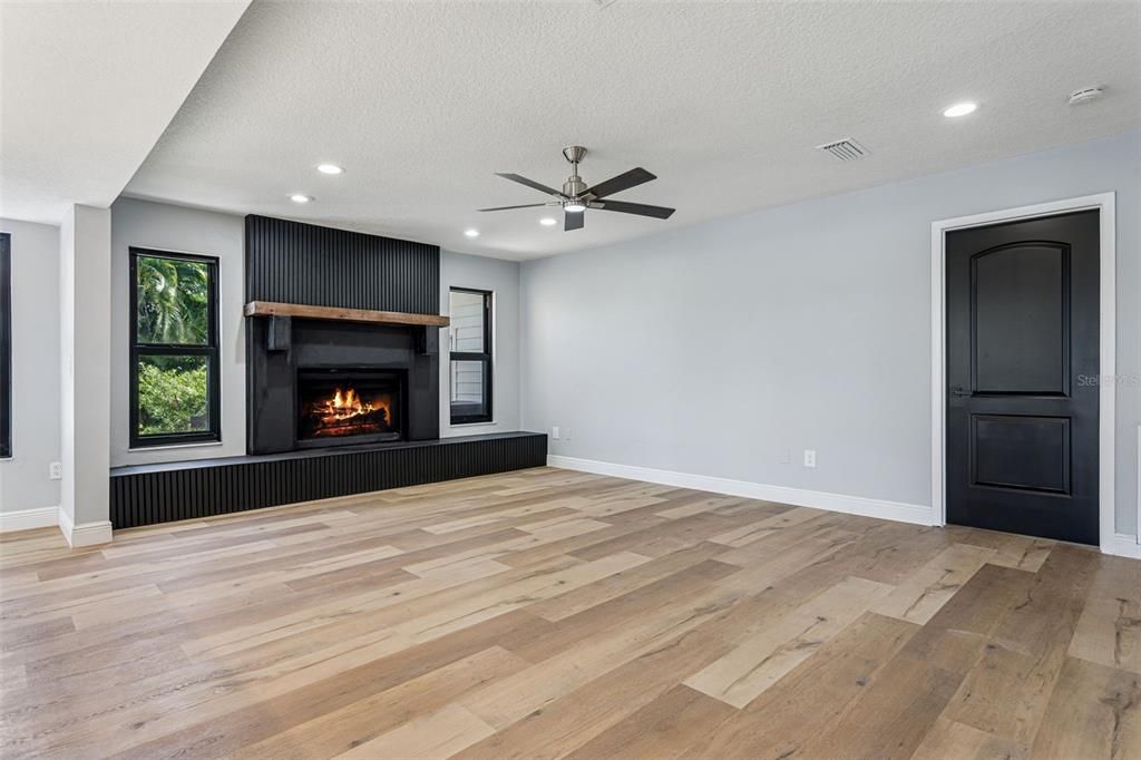 Empty room, Fireplace, Interior, Recessed Lighting, Wood Texture Flooring