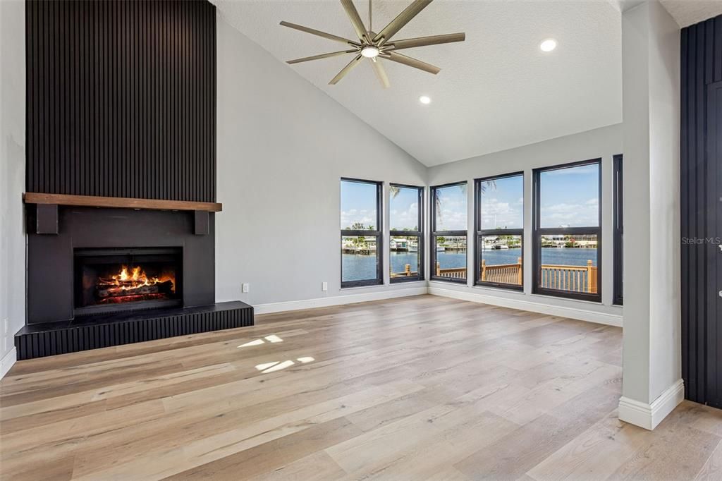 Empty room, Fireplace, Interior, Recessed Lighting, Water, Wood Texture Flooring