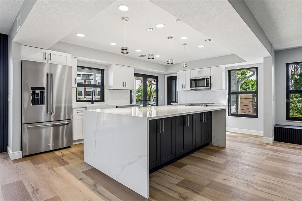 Interior, Kitchen, Marble Walls, Pendant Lights, Recessed Lighting, Stainless Steel Appliances, Wood Texture Flooring