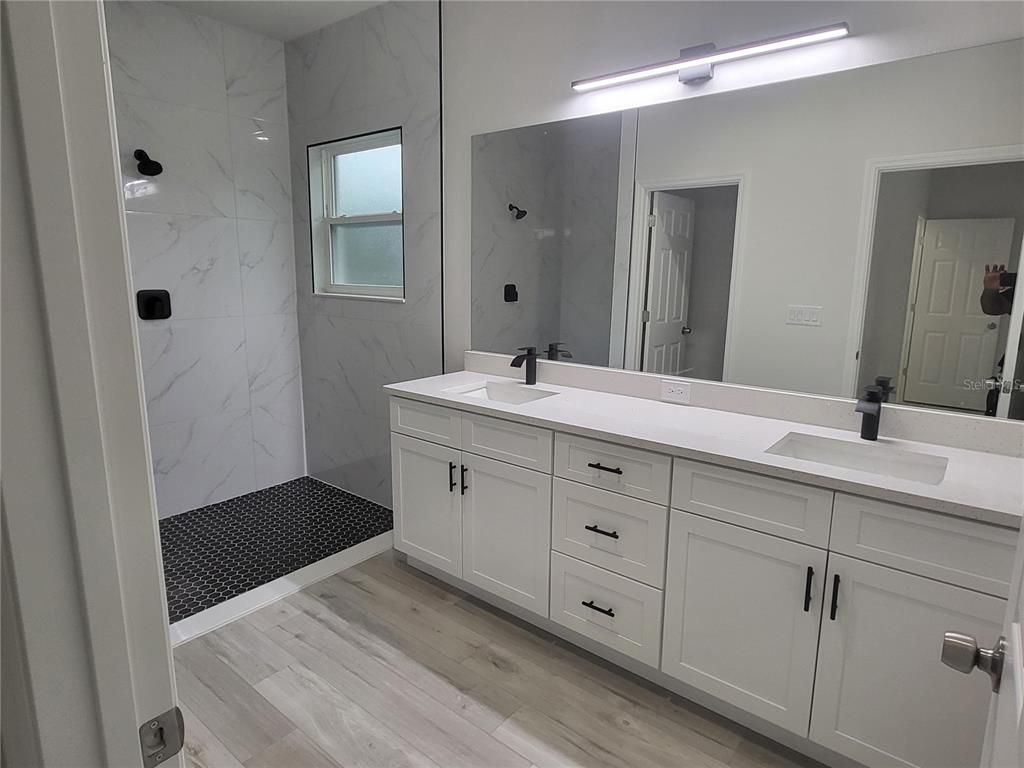 Bathroom, Dual Sink Vanities, Interior, Marble Walls, Wood Texture Flooring