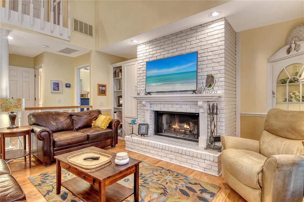 Fireplace, Interior, Living room, Recessed Lighting, Stone Walls, Wood Texture Flooring