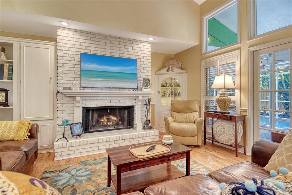 Fireplace, Interior, Living room, Recessed Lighting, Stone Walls, Wood Texture Flooring