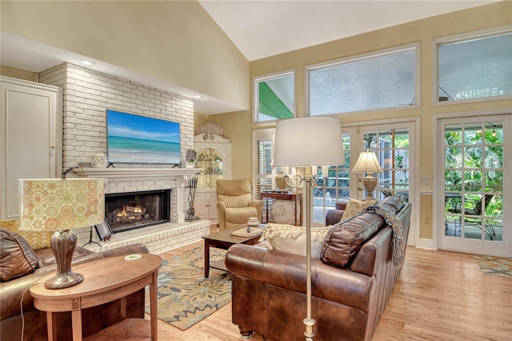 Fireplace, Interior, Living room, Recessed Lighting, Stone Walls, Wood Texture Flooring