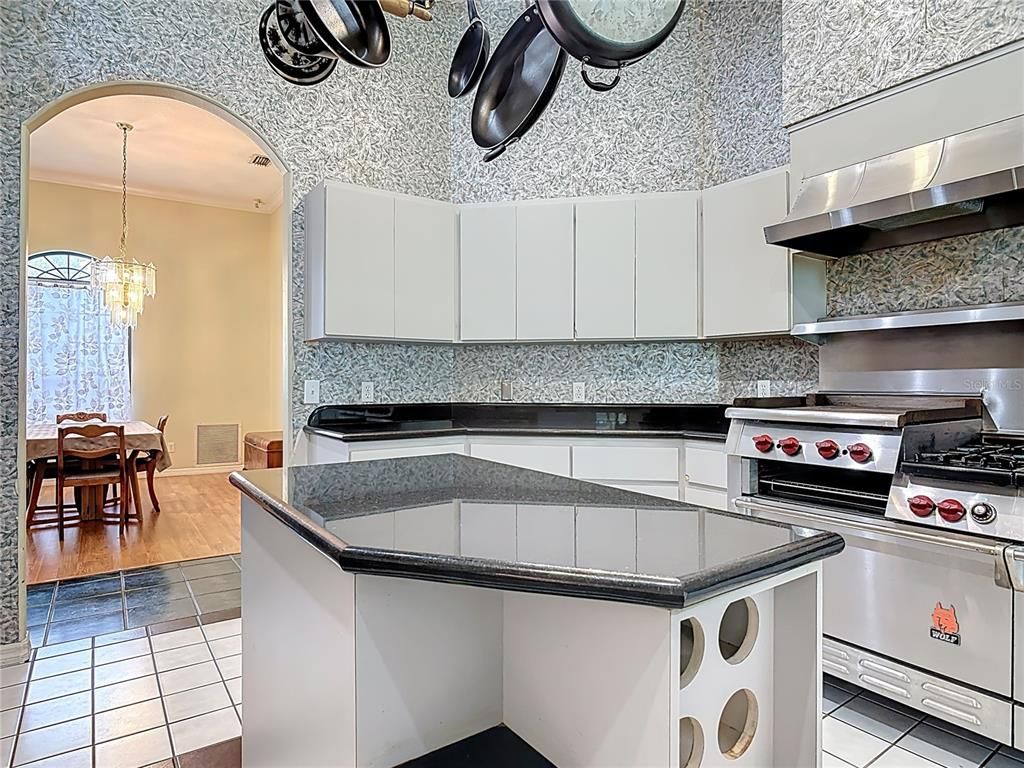 Chandelier, Dining room, Interior, Kitchen, Pendant Lights, Stainless Steel Appliances, Wood Texture Flooring