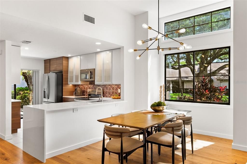 Dining room, Interior, Kitchen, Pendant Lights, Recessed Lighting, Stainless Steel Appliances, Wood Texture Flooring