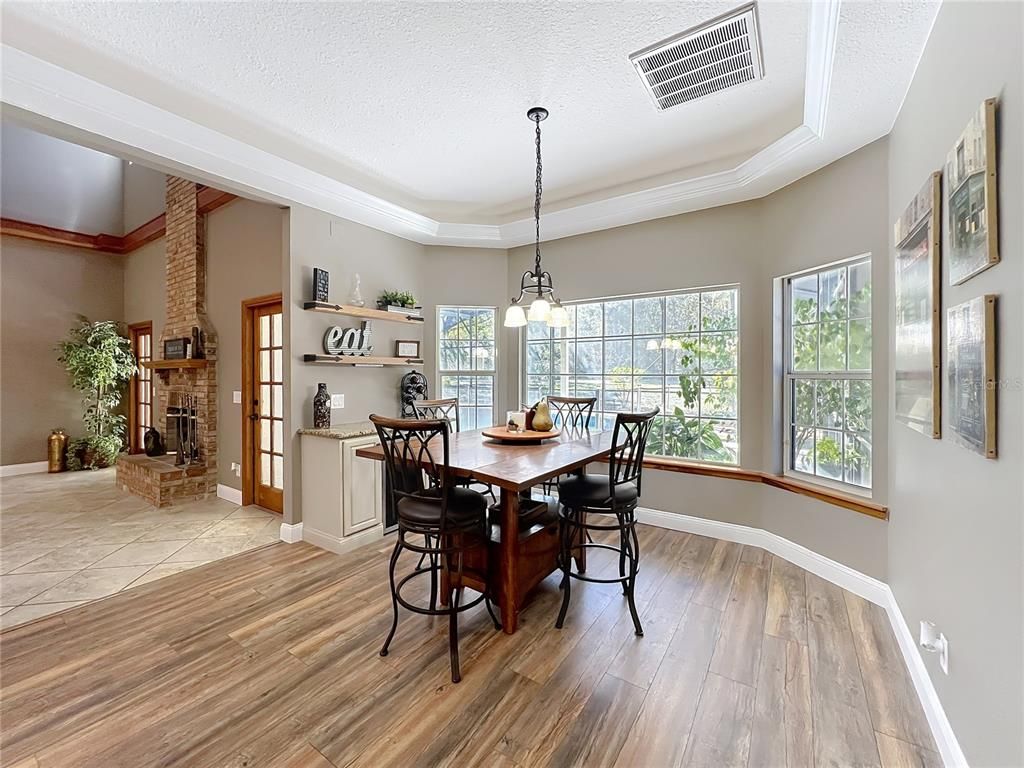 Dining room, Fireplace, Interior, Pendant Lights, Wood Texture Flooring