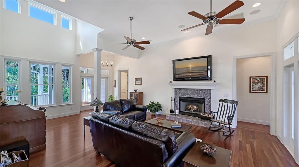 Chandelier, Fireplace, Interior, Living room, Recessed Lighting, Wood Texture Flooring