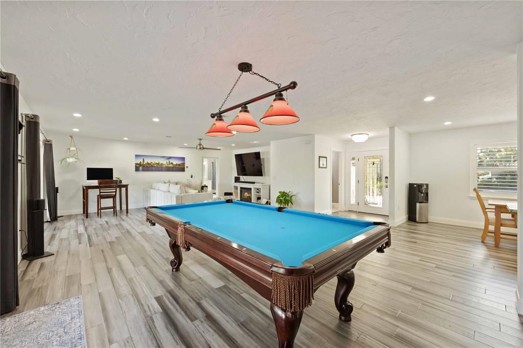 Billiard Table, Chandelier, Game Room, Interior, Pendant Lights, Recessed Lighting, Wood Texture Flooring