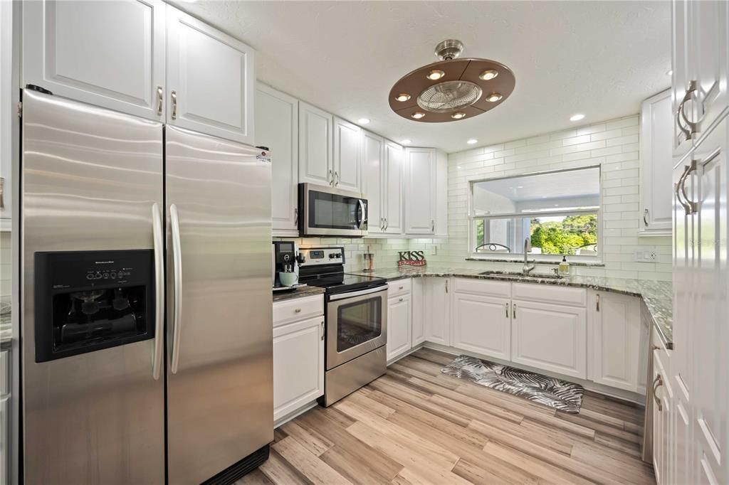 Interior, Kitchen, Recessed Lighting, Stainless Steel Appliances, Wood Texture Flooring