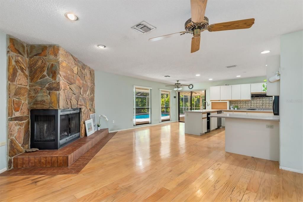 Fireplace, Interior, Kitchen, Recessed Lighting, Stone Walls, Wood Texture Flooring