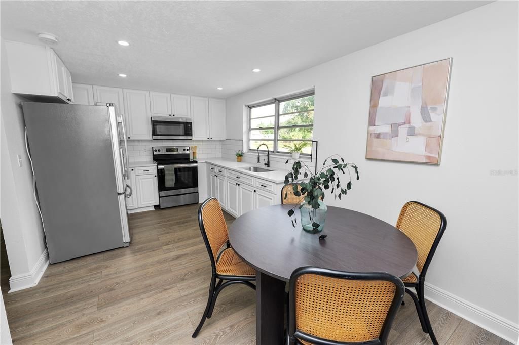 Dining room, Interior, Kitchen, Recessed Lighting, Stainless Steel Appliances, Wood Texture Flooring