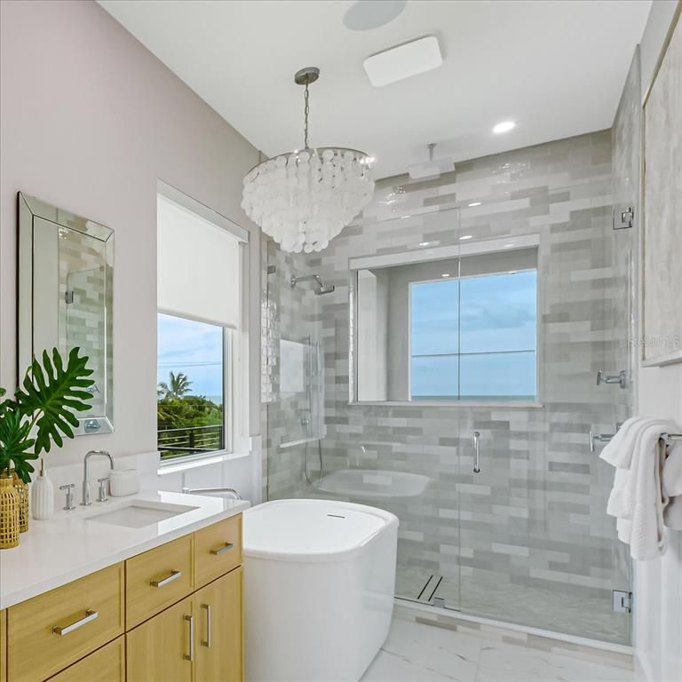 Bathroom, Chandelier, Free Standing Baths, Glass Shower, Interior, Marble, Recessed Lighting, Water