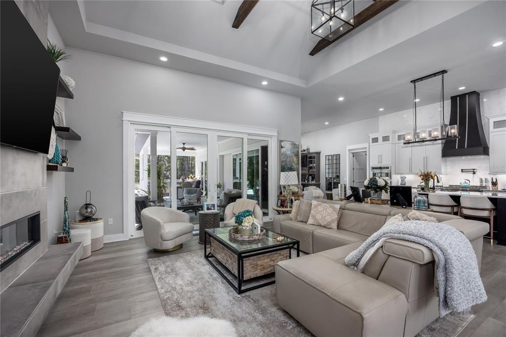 Chandelier, Dining room, Fireplace, Interior, Kitchen, Living room, Pendant Lights, Recessed Lighting, Wood Texture Flooring