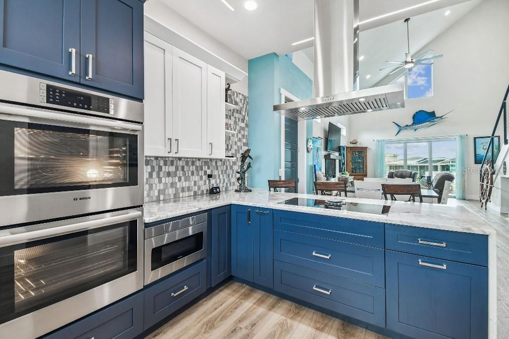 Dining room, Interior, Kitchen, Recessed Lighting, Stainless Steel Appliances, Wood Texture Flooring