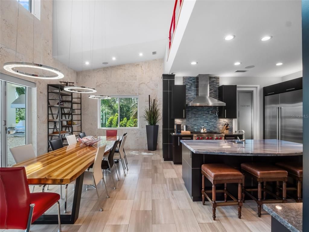 Dining room, Interior, Kitchen, Pendant Lights, Recessed Lighting, Stainless Steel Appliances, Stone Walls, Wood Texture Flooring