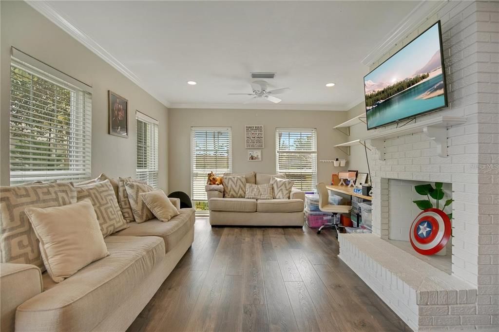 Fireplace, Interior, Living room, Recessed Lighting, Stone Walls, Wood Texture Flooring