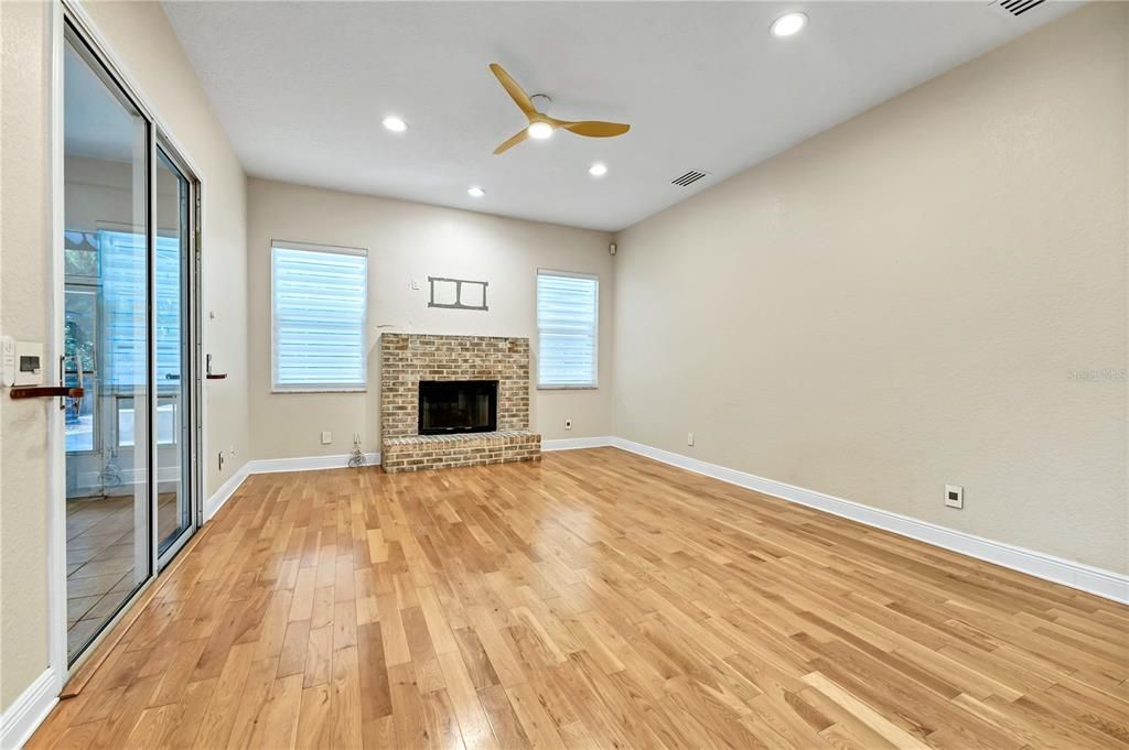 Empty room, Fireplace, Interior, Recessed Lighting, Wood Texture Flooring