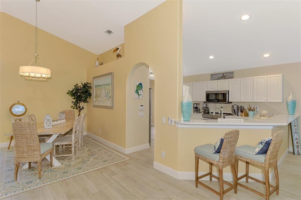 Dining room, Interior, Kitchen, Pendant Lights, Recessed Lighting, Stainless Steel Appliances, Wood Texture Flooring