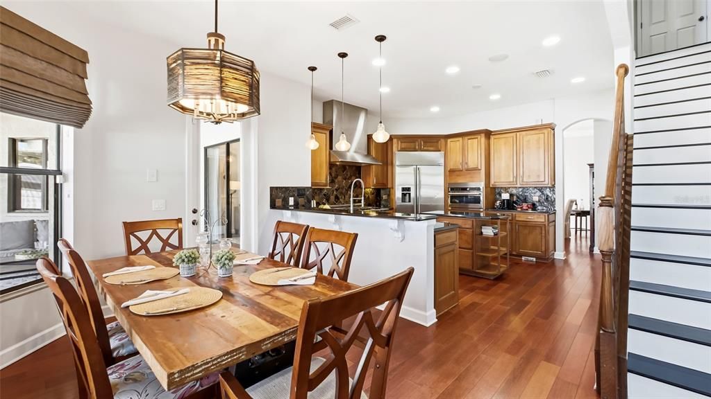 Dining room, Interior, Kitchen, Pendant Lights, Recessed Lighting, Stainless Steel Appliances, Wood Texture Flooring