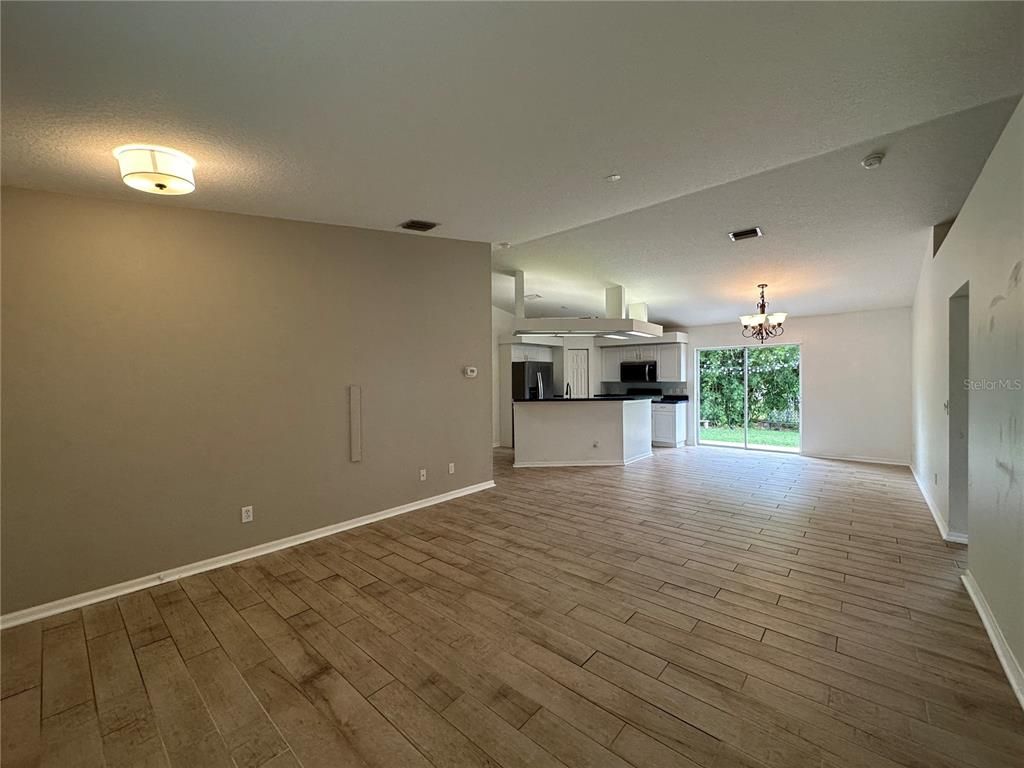 Chandelier, Empty room, Interior, Kitchen, Stainless Steel Appliances, Wood Texture Flooring
