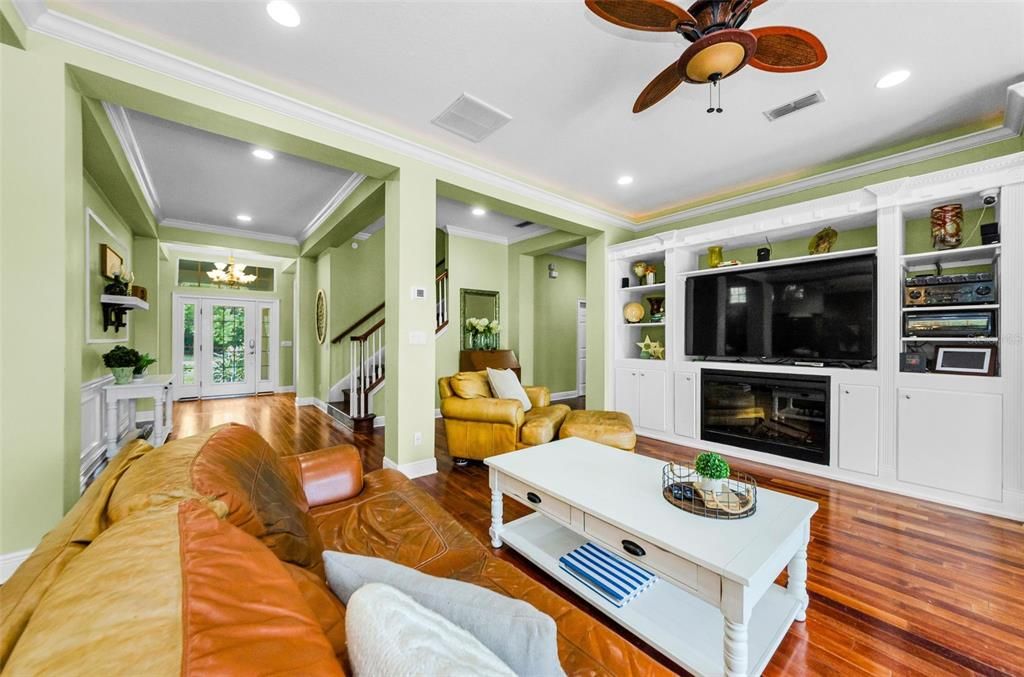 Chandelier, Fireplace, Interior, Living room, Recessed Lighting, Wood Texture Flooring