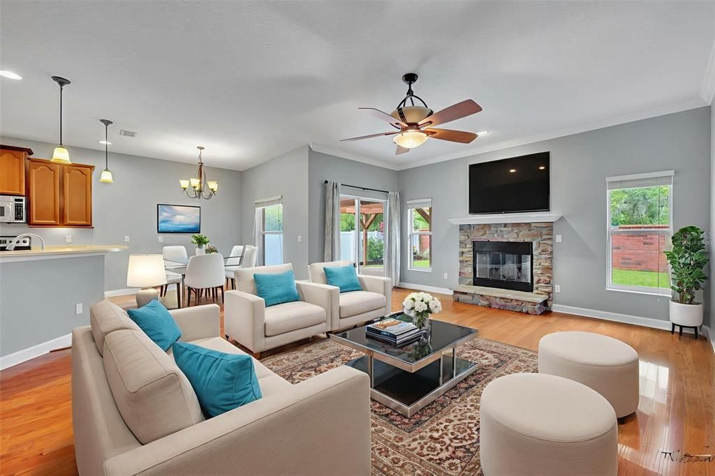 Chandelier, Dining room, Fireplace, Interior, Kitchen, Living room, Pendant Lights, Recessed Lighting, Wood Texture Flooring