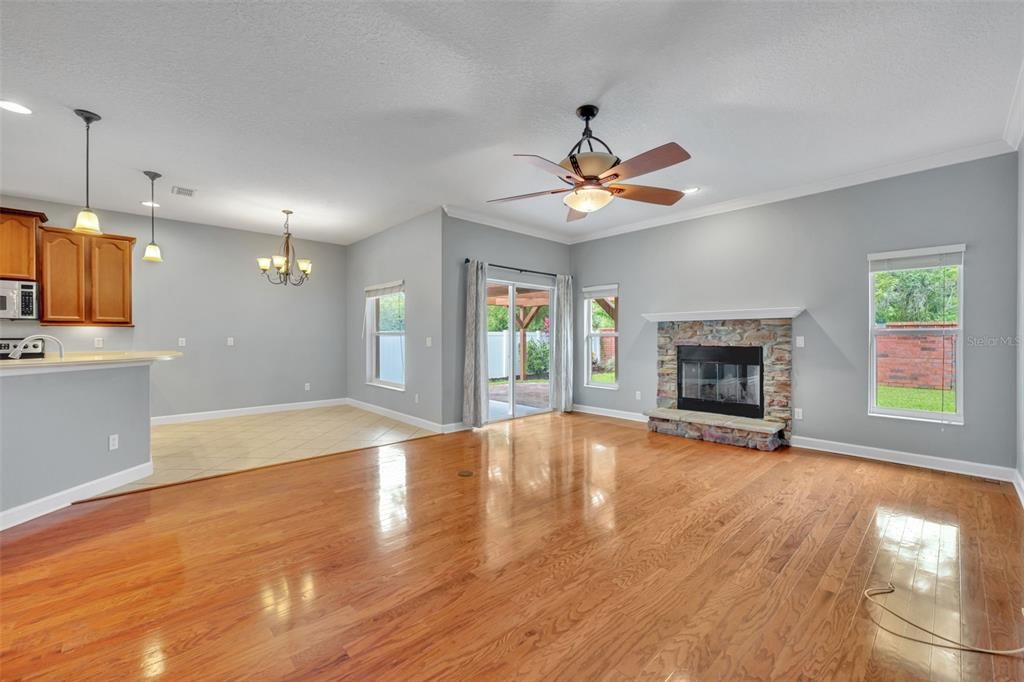 Chandelier, Empty room, Fireplace, Interior, Kitchen, Pendant Lights, Wood Texture Flooring