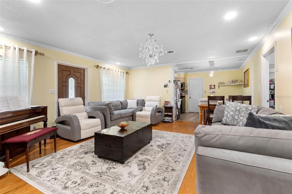 Chandelier, Dining room, Interior, Living room, Piano, Recessed Lighting, Wood Texture Flooring