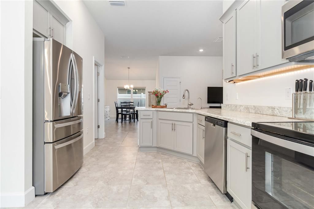 Chandelier, Dining room, Interior, Kitchen, Pendant Lights, Recessed Lighting, Stainless Steel Appliances