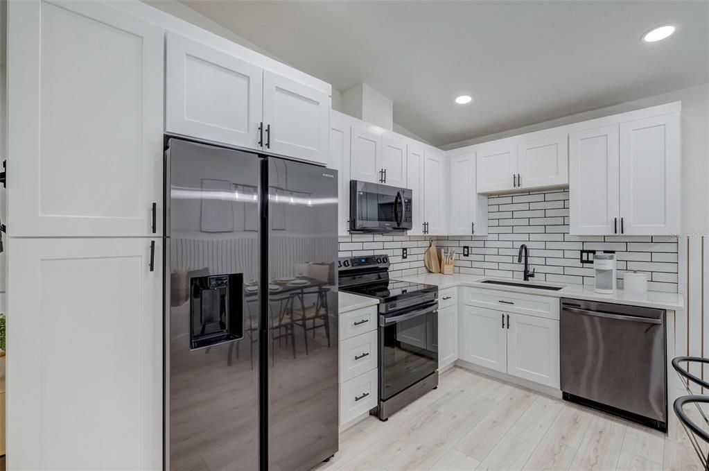 Dining room, Interior, Kitchen, Recessed Lighting, Stainless Steel Appliances, Wood Texture Flooring