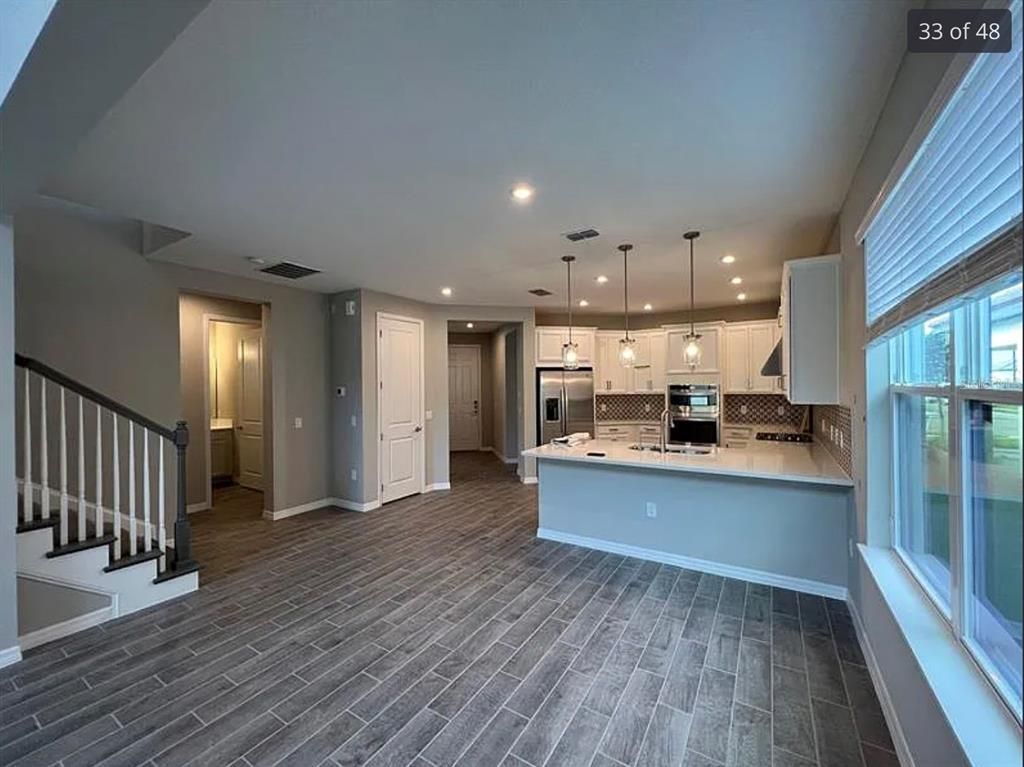 Interior, Kitchen, Pendant Lights, Recessed Lighting, Stainless Steel Appliances, Wood Texture Flooring