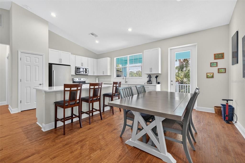 Dining room, Interior, Kitchen, Recessed Lighting, Stainless Steel Appliances, Wood Texture Flooring