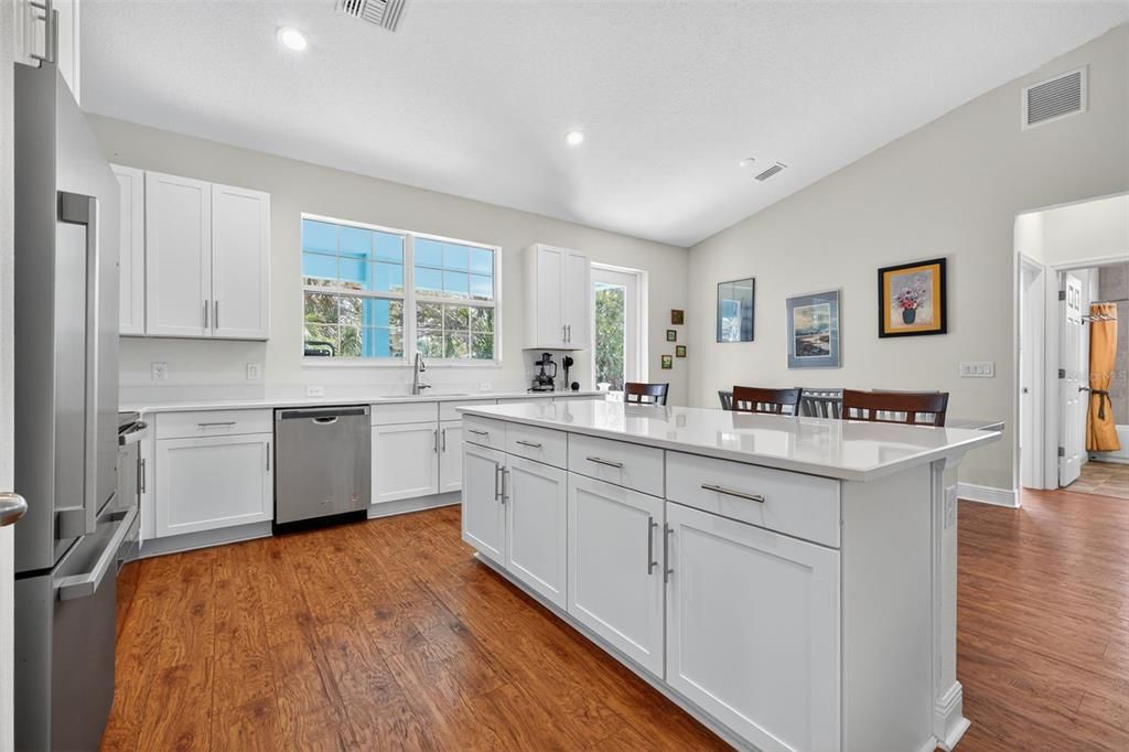 Dining room, Interior, Kitchen, Recessed Lighting, Stainless Steel Appliances, Wood Texture Flooring