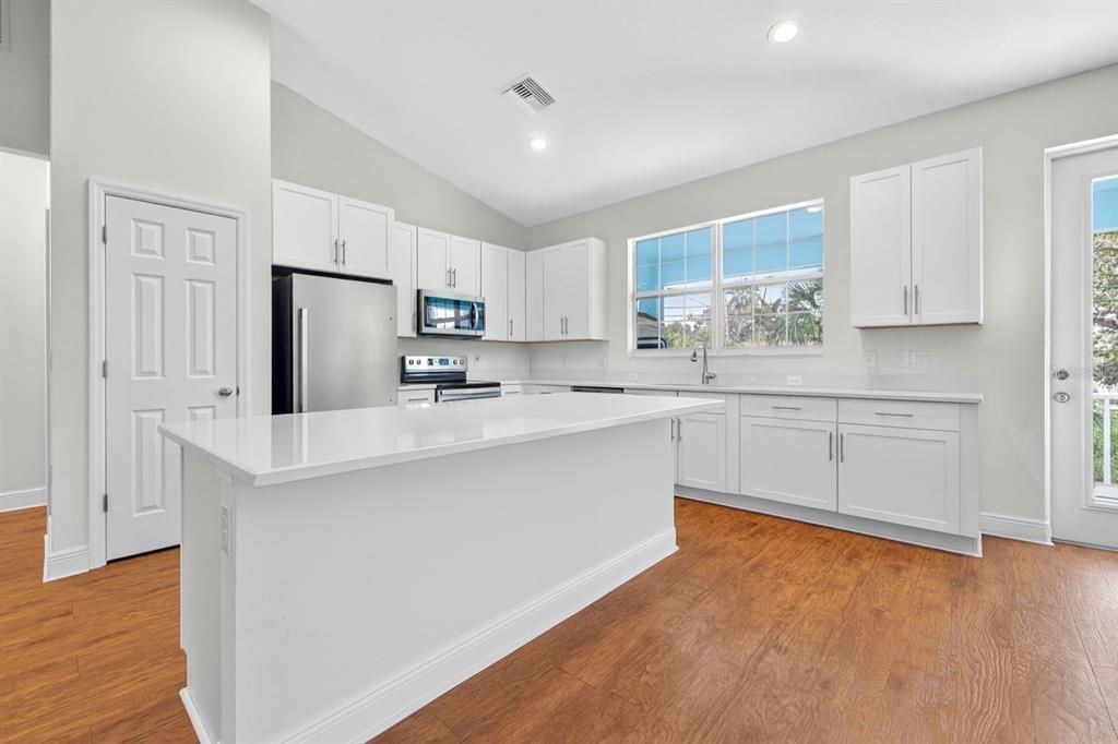 Interior, Kitchen, Recessed Lighting, Stainless Steel Appliances, Wood Texture Flooring