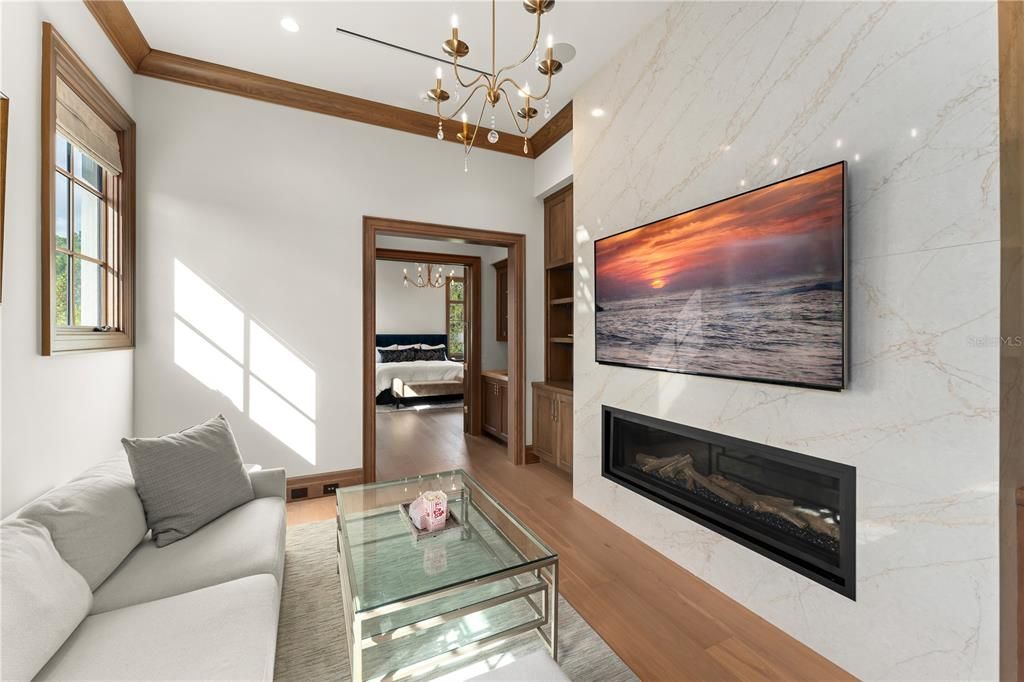 Fireplace, Interior, Living room, Marble Walls, Pendant Lights, Recessed Lighting, Wood Texture Flooring