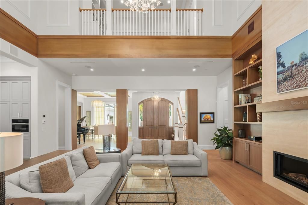 Fireplace, Interior, Living room, Piano, Recessed Lighting, Wood Texture Flooring