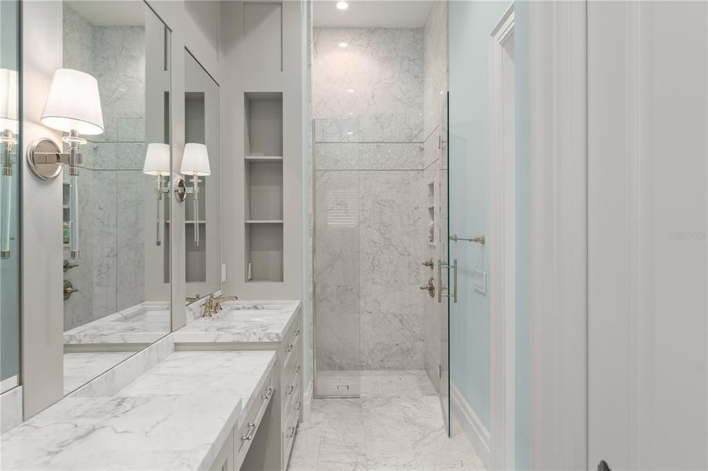 Bathroom, Dual Sink Vanities, Glass Shower, Interior, Marble, Marble Walls, Recessed Lighting