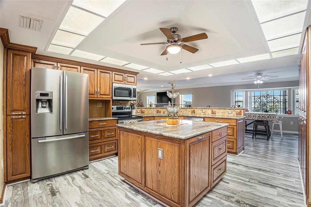 Dining room, Interior, Kitchen, Recessed Lighting, Stainless Steel Appliances, Wood Texture Flooring