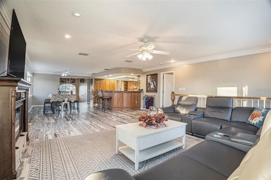 Dining room, Fireplace, Interior, Living room, Recessed Lighting, Wood Texture Flooring