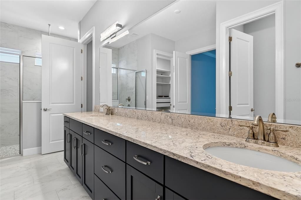 Bathroom, Dual Sink Vanities, Glass Shower, Interior, Marble, Marble Walls, Recessed Lighting