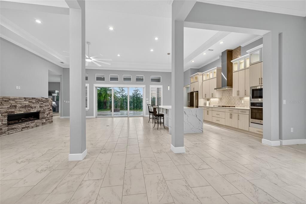 Dining room, Fireplace, Interior, Kitchen, Marble, Recessed Lighting, Stainless Steel Appliances