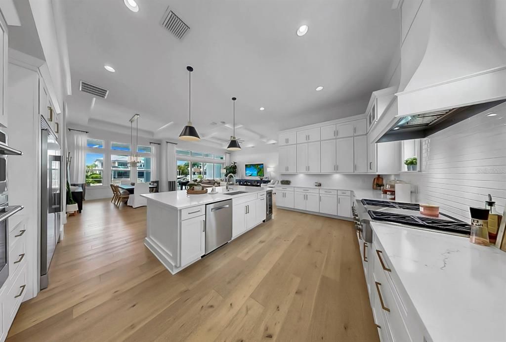 Dining room, Interior, Kitchen, Pendant Lights, Recessed Lighting, Stainless Steel Appliances, Wood Texture Flooring