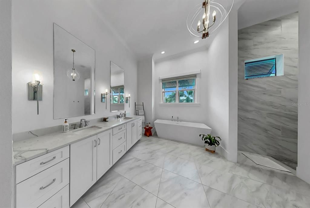 Bathroom, Dual Sink Vanities, Free Standing Baths, Interior, Marble, Marble Walls, Pendant Lights, Recessed Lighting