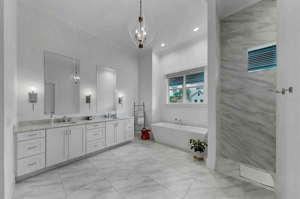 Bathroom, Dual Sink Vanities, Free Standing Baths, Interior, Marble, Marble Walls, Pendant Lights, Recessed Lighting